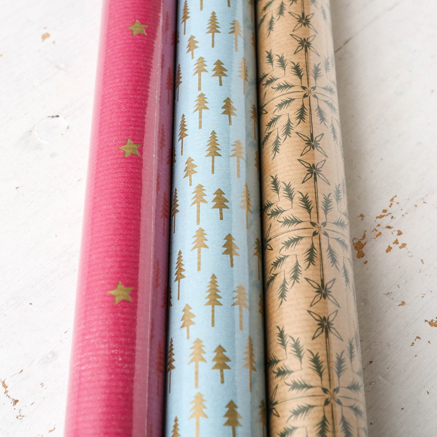 Three Rolls of Christmas Gift Wrap - Graphic Patterns